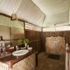 Отель Saadani Safari Lodge - bush, river, beach, фото 27