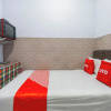 Отель OYO 93976 Maluku Guest House, фото 12