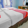 Отель Super OYO 90072 Apri Inn Syariah, фото 9