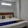 Отель SPOT ON 92822 Finest House Near Amplas Bus Terminal, фото 7