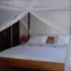 Отель Three Bedroom Cottage на пляже Diani Beach