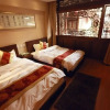 Отель Lijiang Jinli Chinese Courtyard Inn, фото 50