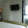 Отель Alpha Apartments Melbourne, фото 2