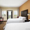 Отель Four Points by Sheraton Hotel & Suites Calgary West в Калгари 