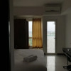 Отель Homey and Nice Studio Apartment at Scientia Residence, фото 10