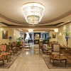 Отель Magnum Hotel & Suites West Bay, фото 2