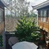 Отель Tree's Tale Hotel - Lijiang, фото 1