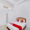 Отель OYO 90387 Sepakat Guest House, фото 4
