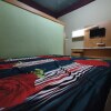 Отель OYO 90976 Bagus Family Kost, фото 3