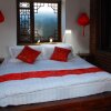 Отель Lijiang Lazy Tiger Inn, фото 3
