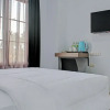 Отель Capital O 92583 Raja Soeta Hostel Syariah, фото 6