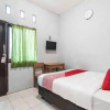 Отель OYO Living 1756 Amira Guest House, фото 7