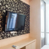 Отель Warm Studio Apartment At Tamansari Papilio, фото 1