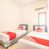 Отель OYO 863 Tenacity Guest House Syariah, фото 3