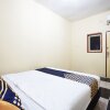 Отель Tiga Mas Inn by OYO Rooms, фото 12