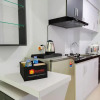 Отель Compact and Cozy Tamansari Mahogany Studio Apartment, фото 9