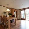 Отель Chalet in Holiday Park With Spacious Living Room, Large Enclosed Garden and Unobstructed View, фото 12