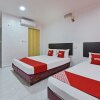 Отель OYO 90806 Rumah Tumpangan Laut Selatan, фото 4