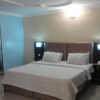 Отель Moongate Hotel and Suites, Obantoko, фото 3