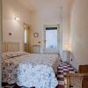 Отель Gli Iris Apartments - Casa Fucsia by Wonderful Italy, фото 2