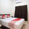 Отель OYO 765 Wisma Andalas Asri Syariah, фото 6