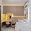 Отель Cozy And Minimalist Studio (No Kitchen) At Aeropolis Apartment, фото 1