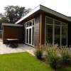 Отель Modern chalet with beautiful garden, located in a holiday park by the forest, фото 16