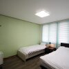 Отель Jeju Suncity Guesthouse, фото 7