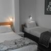 Отель Boer And Brit Self Catering Guest House, фото 4