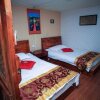 Отель Lijiang Xunniuge Guest House, фото 4