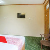 Отель OYO 90189 Roemah Kayoe, фото 13