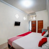 Отель OYO 90751 Graha Sei Batugingging, фото 14