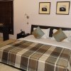 Отель Pearl Manor Luxury Suites в Абудже