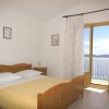 Отель Apartment Niko - 50 m from pebble beach: A4 Pisak, Riviera Omis, фото 6