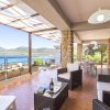 Отель Villa Flavia direttamente sul mare con terrazza incantevole per 6 persone в Алжере