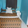 Отель Chez Ophelia Cottage Apartments в Массакре