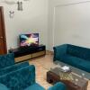 Отель AMs Den in DHA - Lovely two bedroom independent Apartment в Карачи 