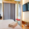 Отель Cozy Studio With City View At Tamansari Papilio Apartment, фото 10