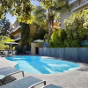 Отель MidCentury Poolview Retreat by LuxPads, фото 6