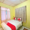 Отель OYO 92503 Penginapan & Villa Sirait, фото 7