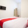 Отель Kamani Homestay Syariah by OYO Rooms, фото 5