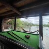 Отель Woodpecker Log Cabin with hot tub, pizza oven bbq entertainment area, lakeside with private fishing , фото 30