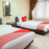 Отель OYO 1740 Tekmira Residence Supratman Syariah, фото 15