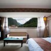 Отель Jiuzhaigou Jinzhukangbalinka Hotel, фото 7