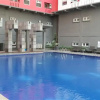Отель Homey 1BR with Spacious Living Room and Sofa Bed Green Pramuka Apartment, фото 16