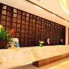Отель Yantai Shunhe Huaqiao Hotel, фото 1