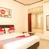 Отель OYO 353 Loesje Guest House Syariah, фото 5