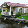 Отель Cozy Chalet Right on the Water in Friesland, фото 5