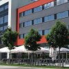 Отель Ramada Herzogenaurach Herzo-Base в Херцогенаурахе