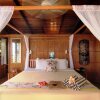 Отель Coconut Grove Beachfront Cottages, фото 16